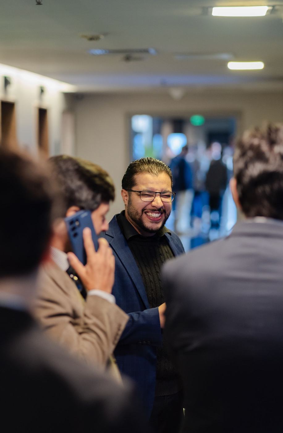 Professionals talking at a business networking event